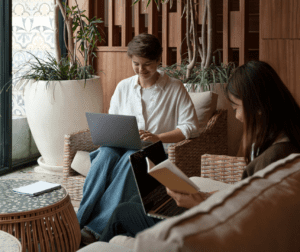 two employees sit together during work hours