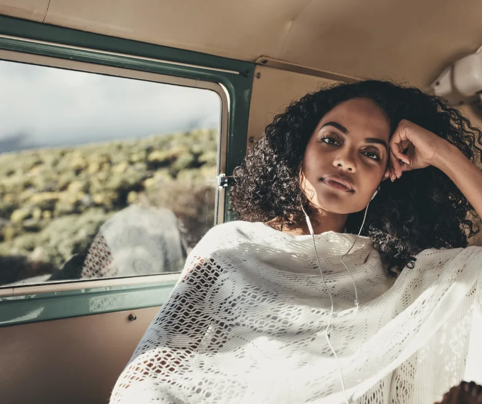 woman ponders urban sprawl in a bus as she drives to work