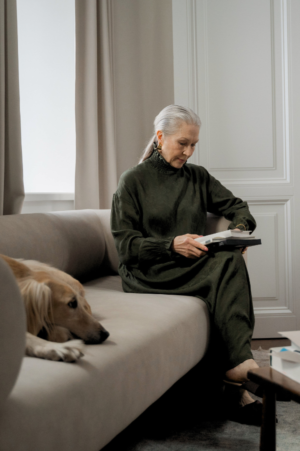 woman microlearning with a dog on her couch