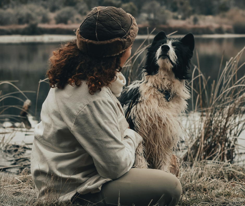 woman sits with her dog and wonders how to prevent separation anxiety in dogs