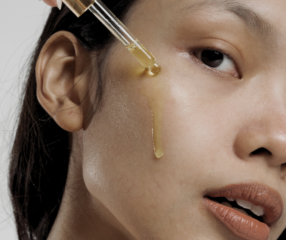 woman using a dropper of fermented skincare acid