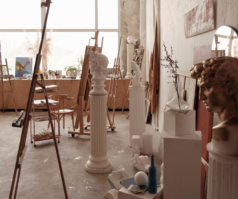 art guild studio with large windows and lots of easels