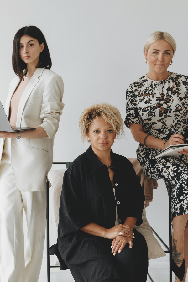 three businesswomen managing their business payroll online
