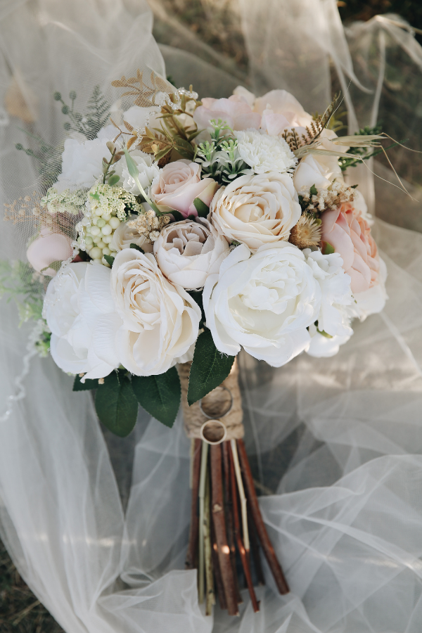 a pale pink, white, and green bridal bouquet (wedding bouquet)