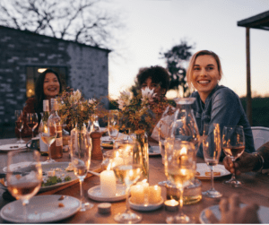 eco-friendly summer gathering with three friends around a table