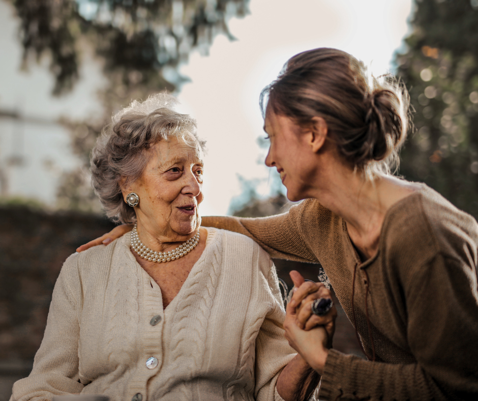 an elderly woman with her daughter who is a member of the sandwich generation