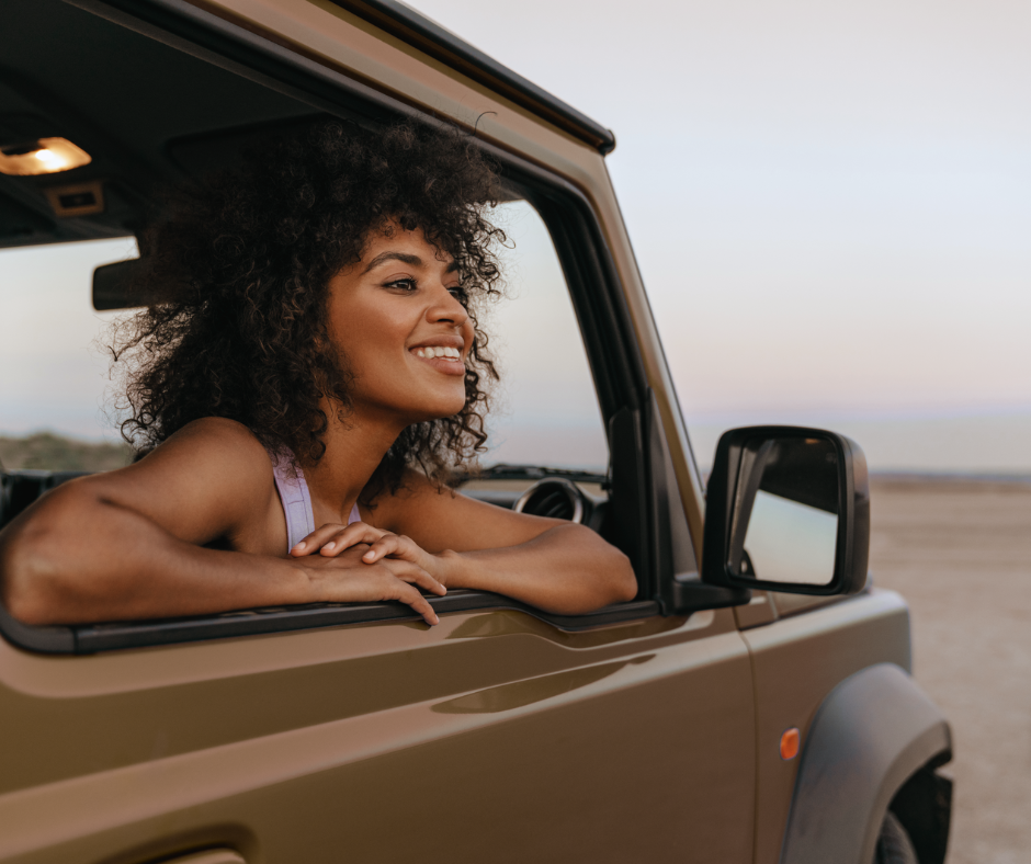 woman riding in a jeep