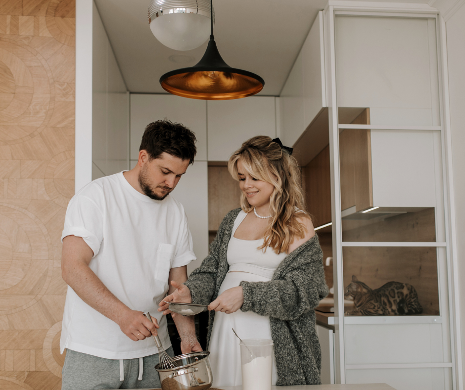 a couple meal prepping in their kitchen