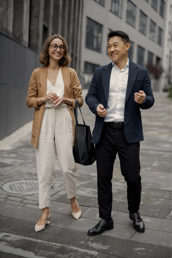 woman walking outside with a man in the city