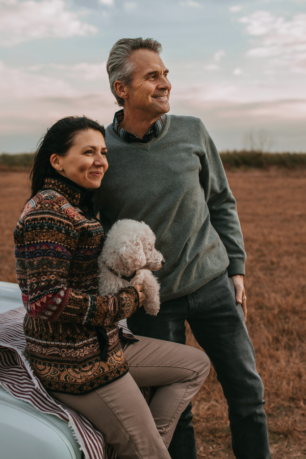 a couple with their dog outside