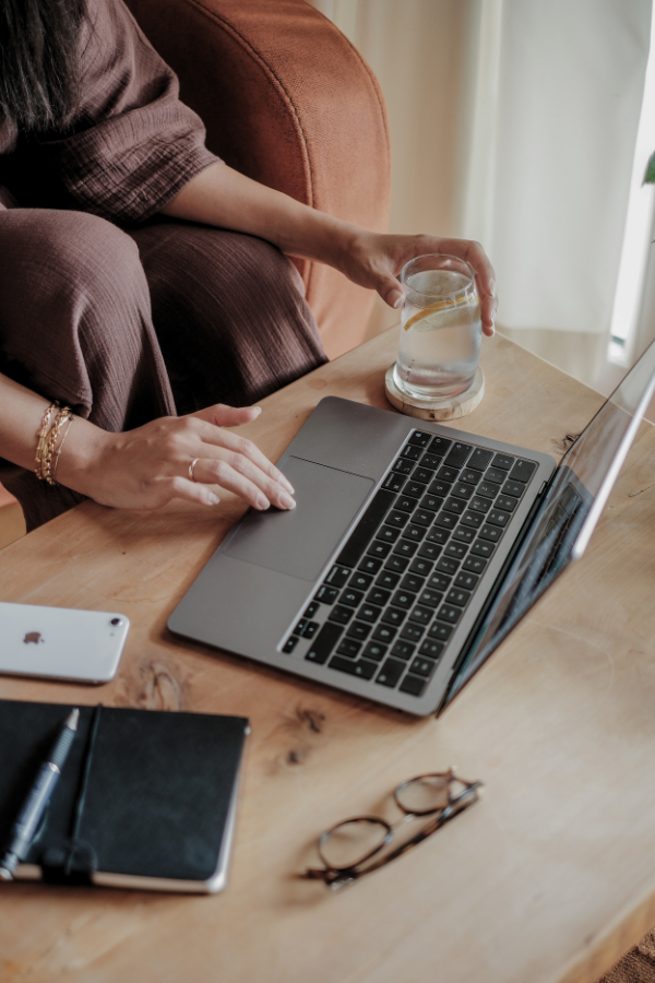 a woman typing on her computer