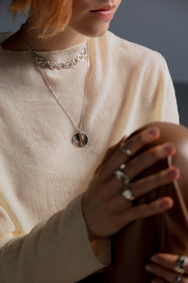 a woman wearing silver jewelry