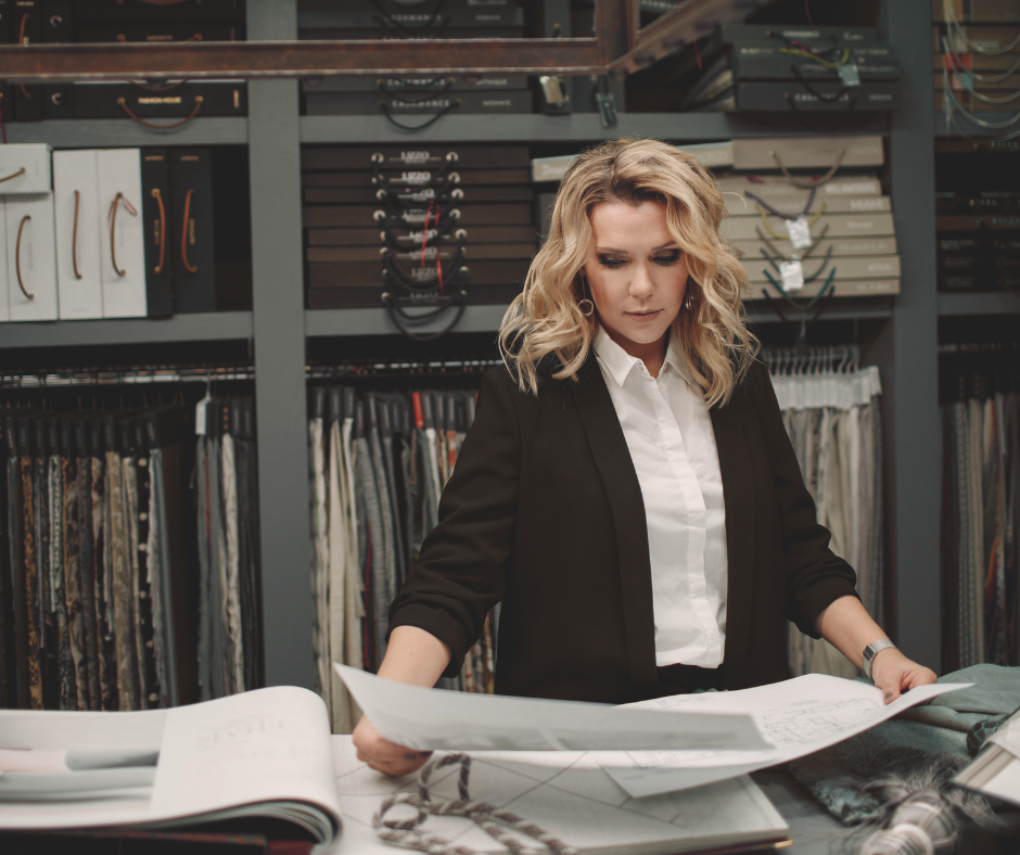 a female interior designer in her studio looking at papers