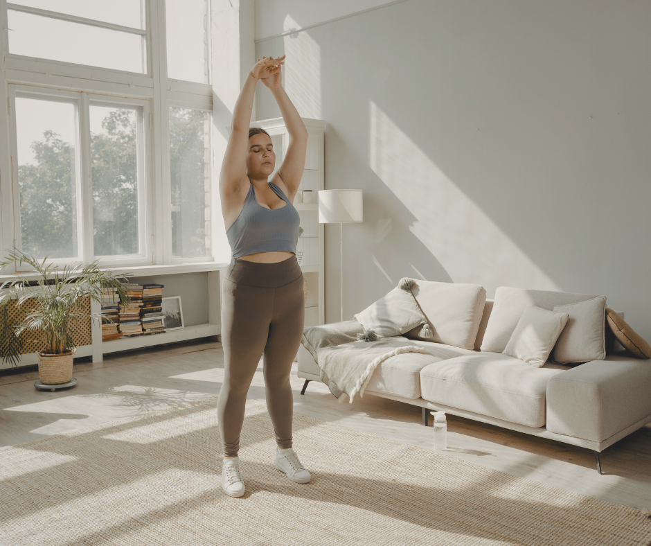 a woman stretching in her apartment