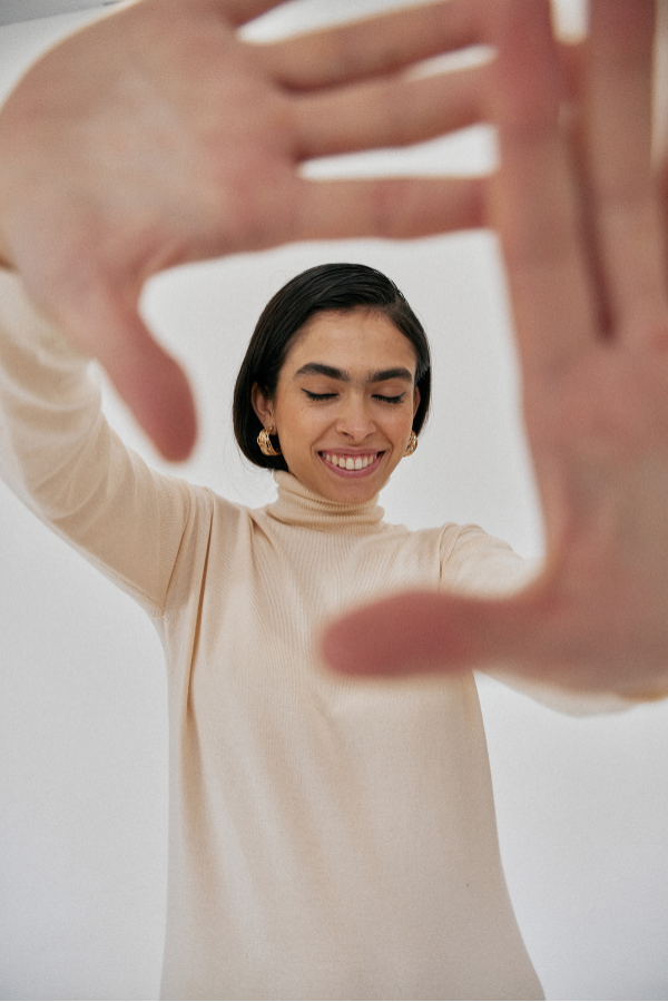 woman with her hands framing her face