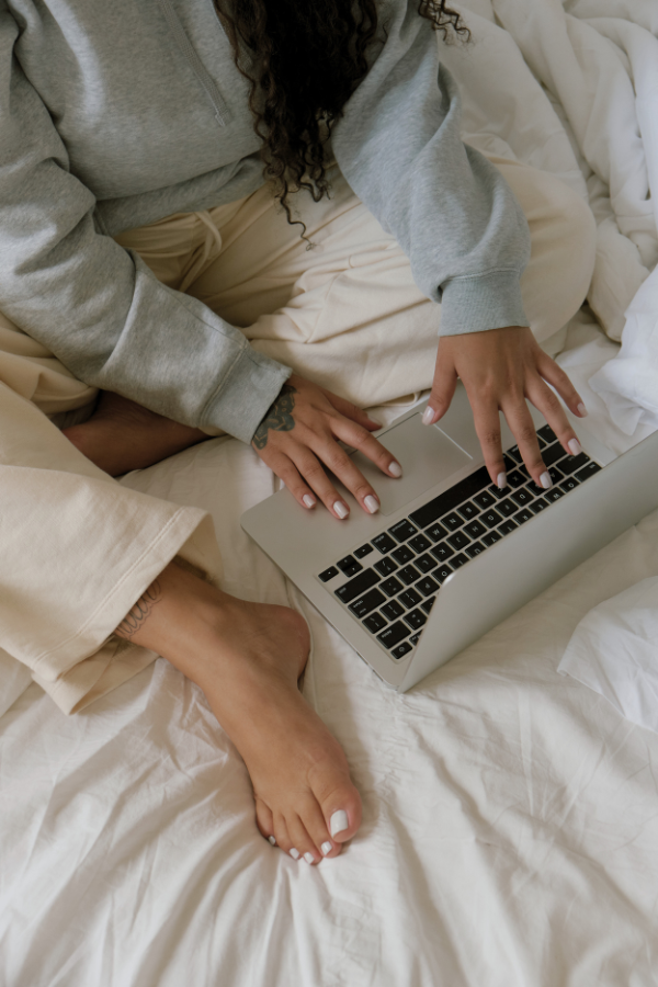 woman working from bed