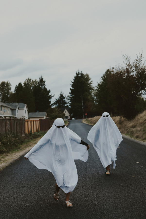 two women dressed as ghosts for Halloween