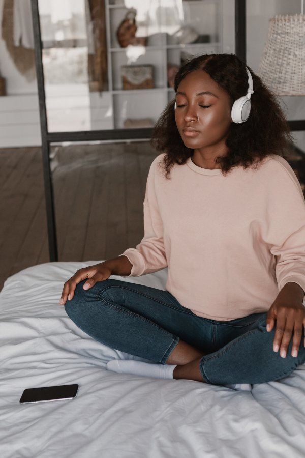 a woman listening to headphones