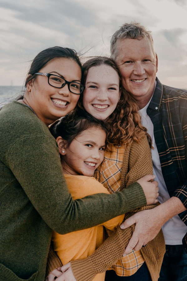 a family on the beach during a family meeting