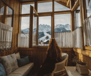 woman taking a true break in a skii lodge instead of working on vacation