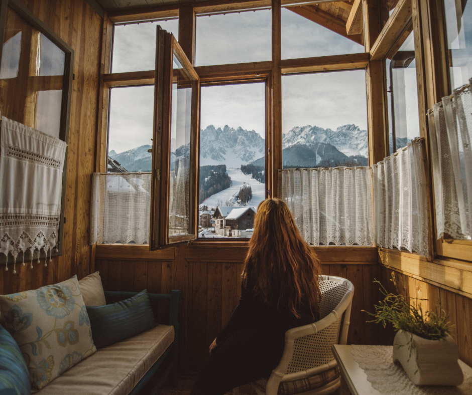 woman taking a true break in a skii lodge instead of working on vacation