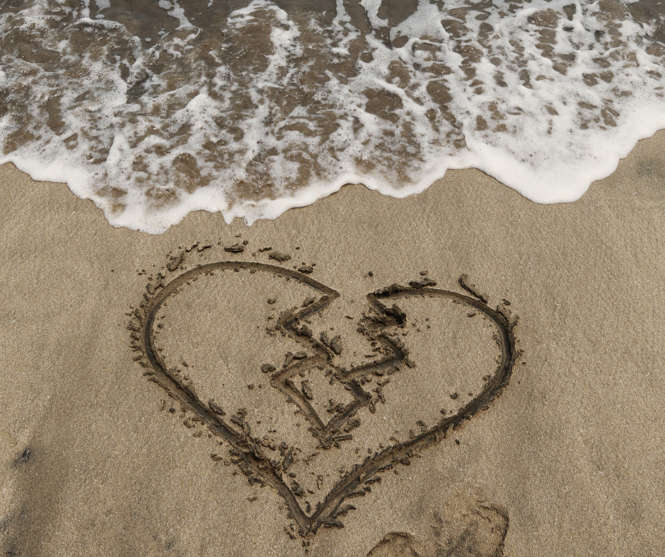 a broken heart on the beach after a friendship breakup