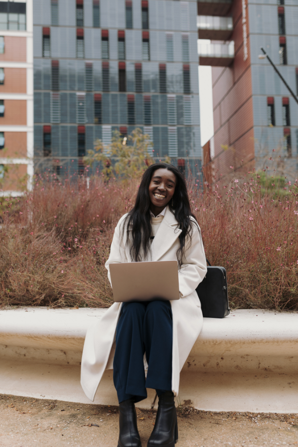 a woman juggling multiple projects on her laptop