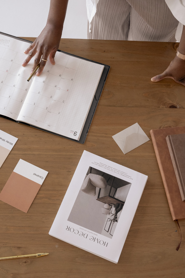 An interior designer looking at objects on her desk