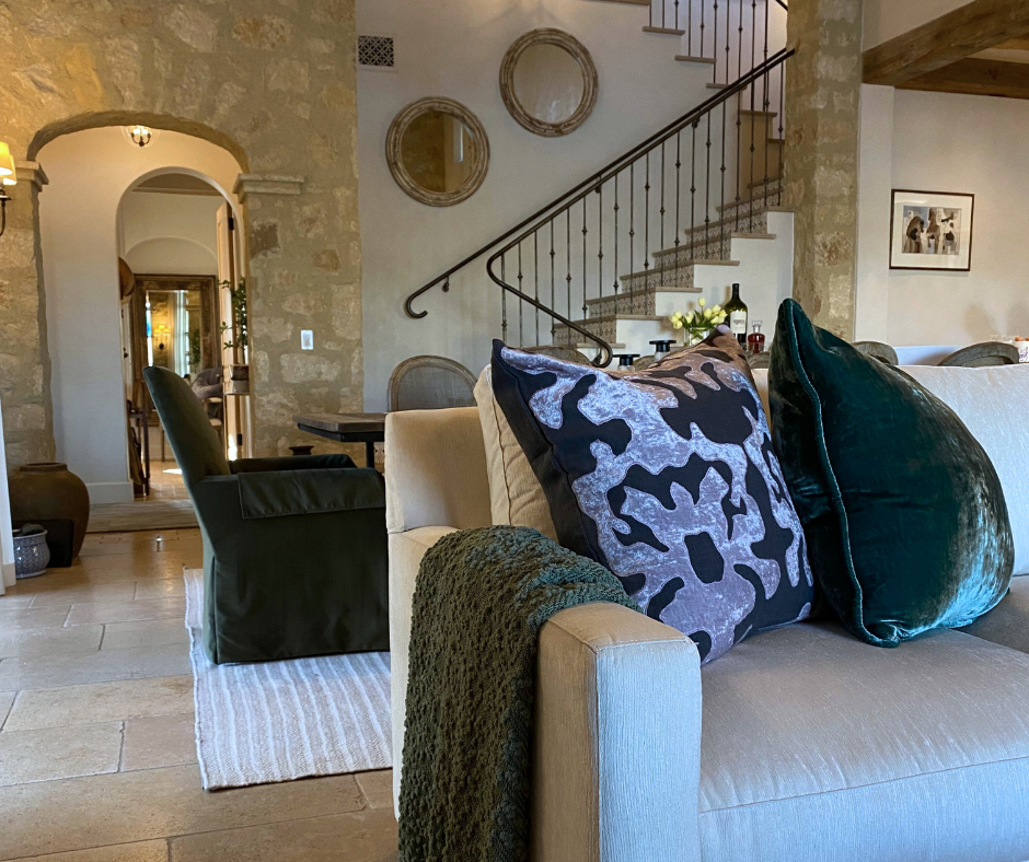 textured stone walls in a transitional living room inspired by Tuscany