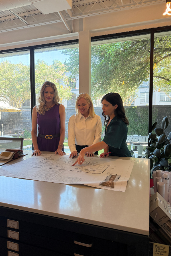 designers gather around a table