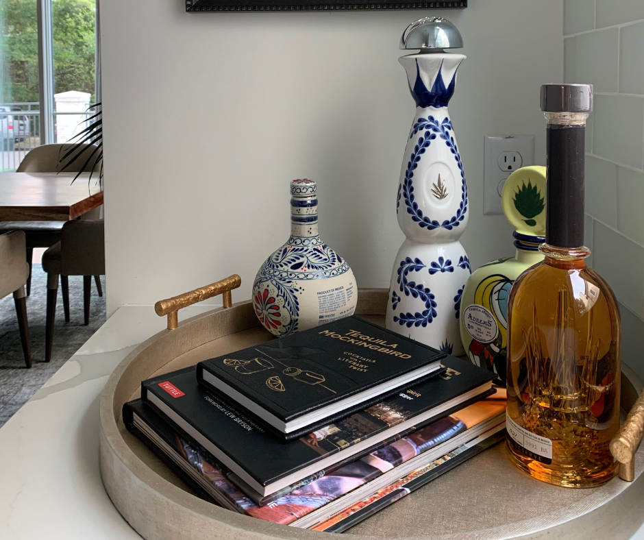 cocktail books arranged on a tray