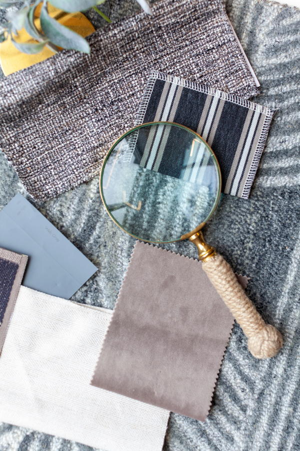 an assortment of textiles with a magnifying glass