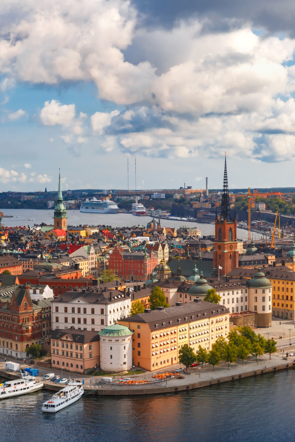 A sunlit aerial view of Stockholm’s historic waterfront and architecture, reflecting Sweden’s design culture that forms the backdrop for Stockholm Design Week and the Stockholm Furniture Fair, a key event for the furniture industry, interior designers, and international trade fair calendar visitors.