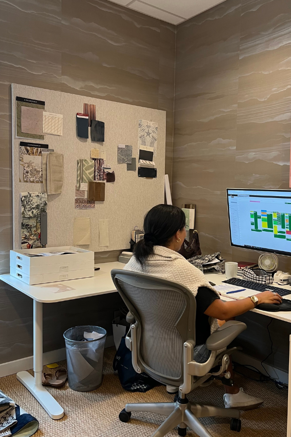 a woman arranges blocks on her laptop according to SOPs