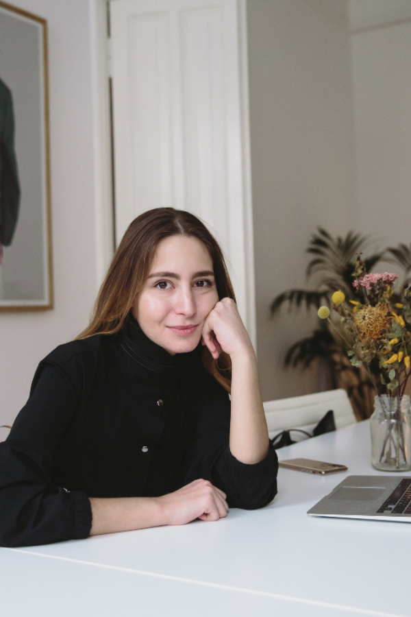 an uncertain interior designer sitting at her desk