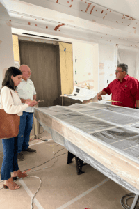 a design team gathers around a table on site