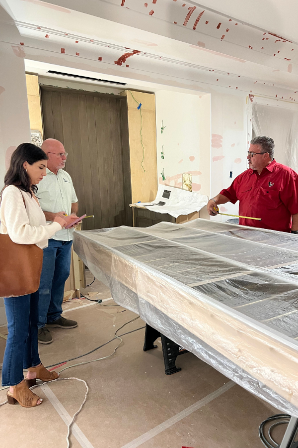 a design team gathers around a table on site