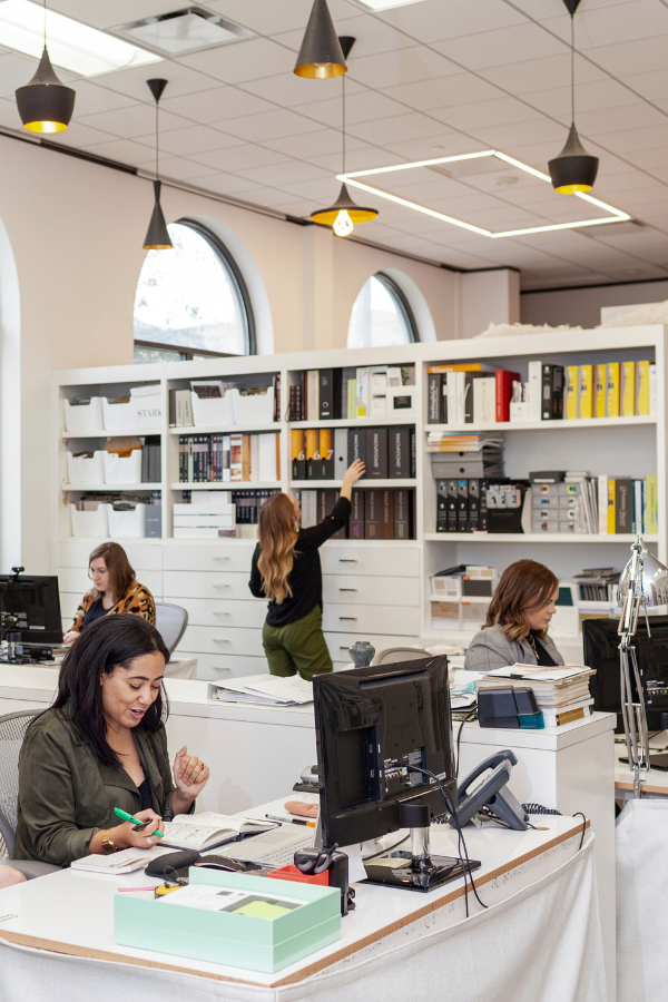a group of interior designers in a design firm studio
